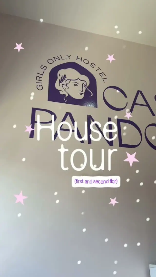 Cover of the Instagram reel “House tour, part two”: the lounge wall logo under pink stars